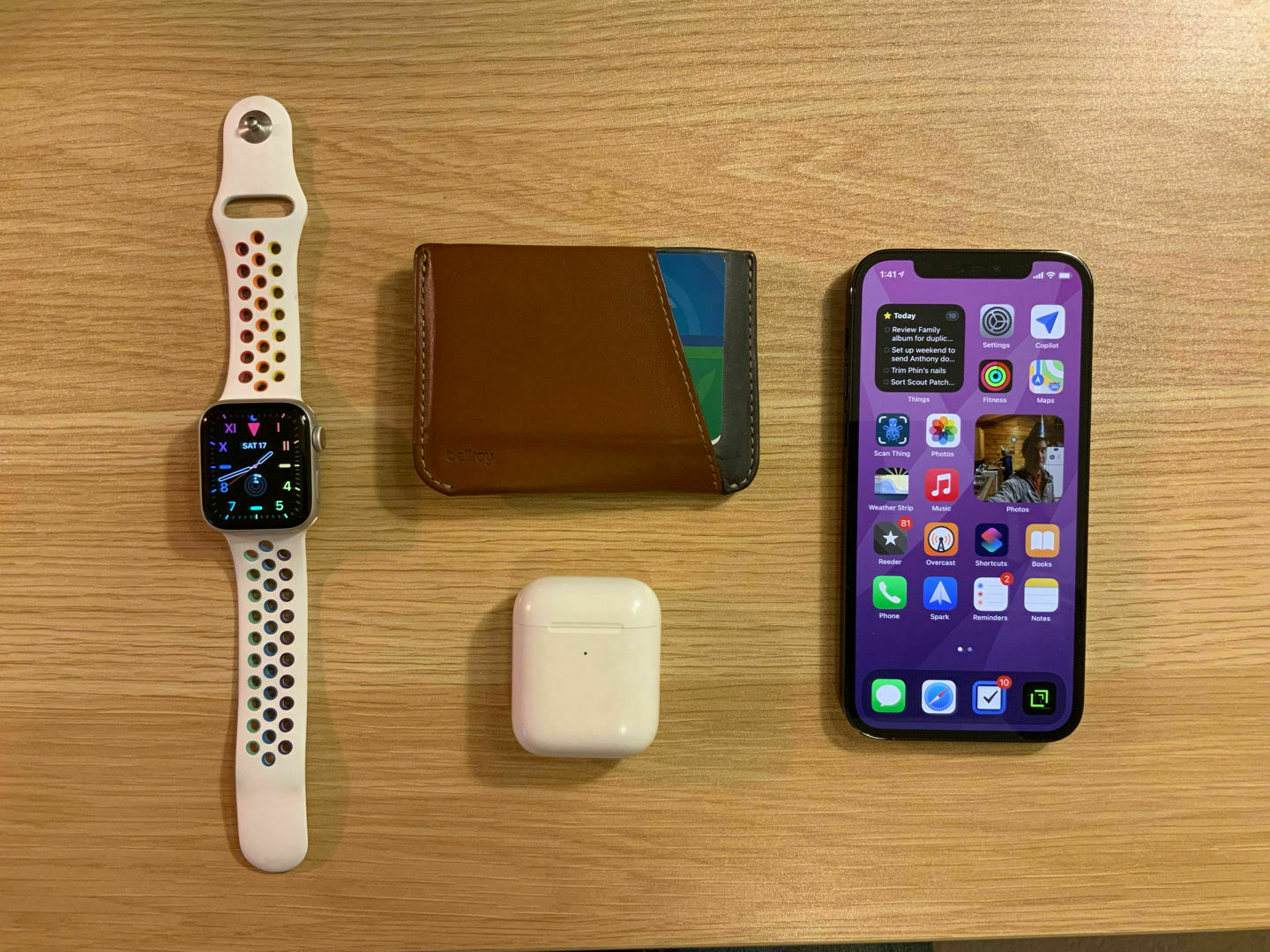 My wallet, iPhone, AirPods, and Apple Watch.