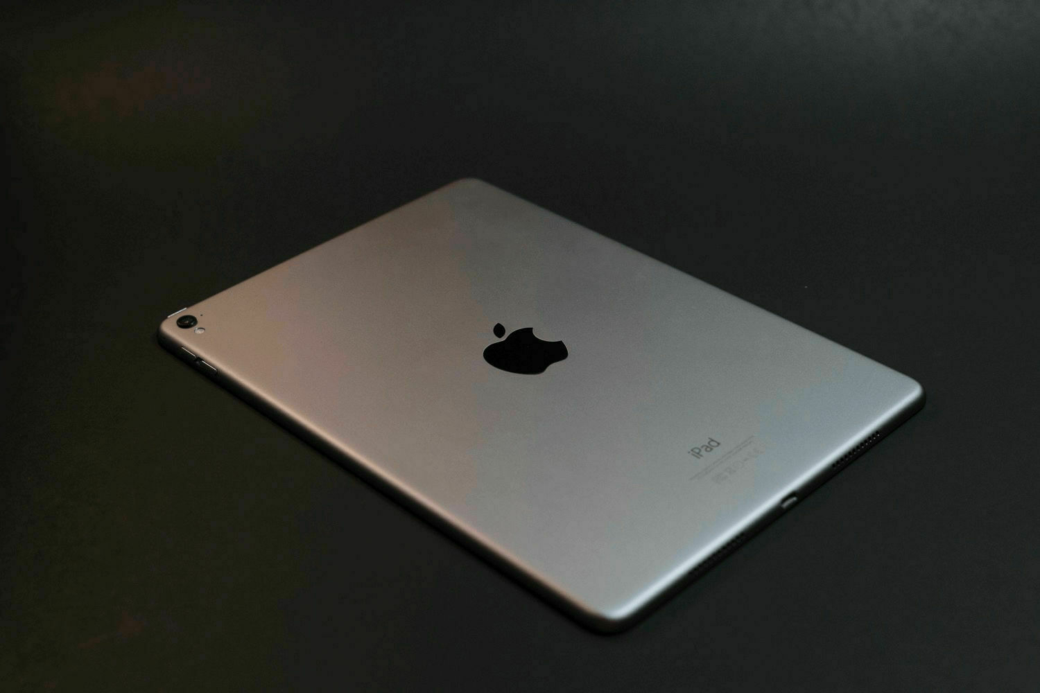 A photo of the back of an iPad on a table.