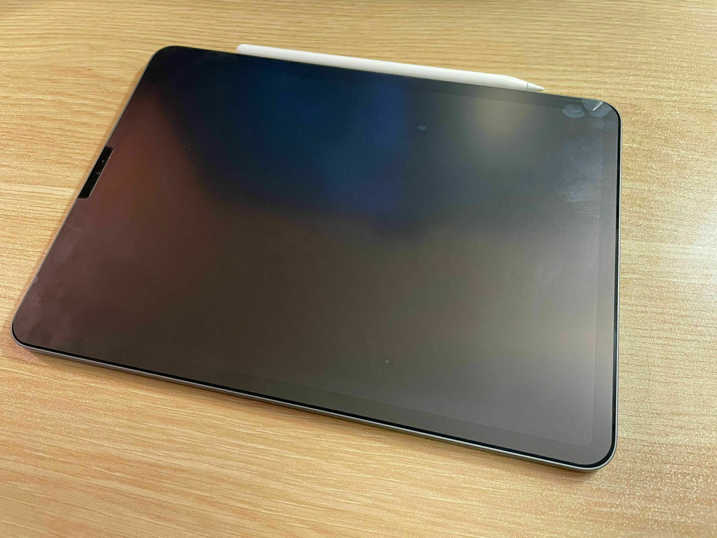 And iPad on a desk with Paperlike installed.