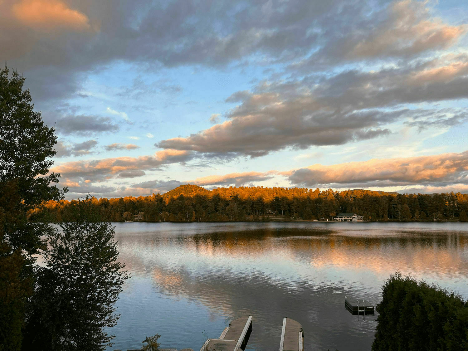 Sunset over mountains and lake.
