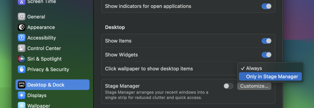 Screenshot of macOS System Settings with the “Desktop & Dock” option selected. Under the “Desktop” section there’s a setting named “Click wallpaper to show desktop items” with the dropdown showing “Always” and “Only in Stage Manager”.